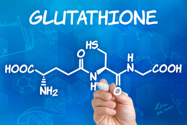 A hand drawing the word glutathione on a blue background for physical therapy.